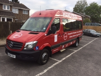 A photograph of a red Handybus in West Berkshire