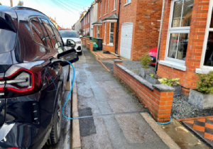 A cross-pavement charging channel installed in Newbury that allows residents with street parking to charge their car at home.