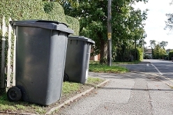 2025 - black bins on a street